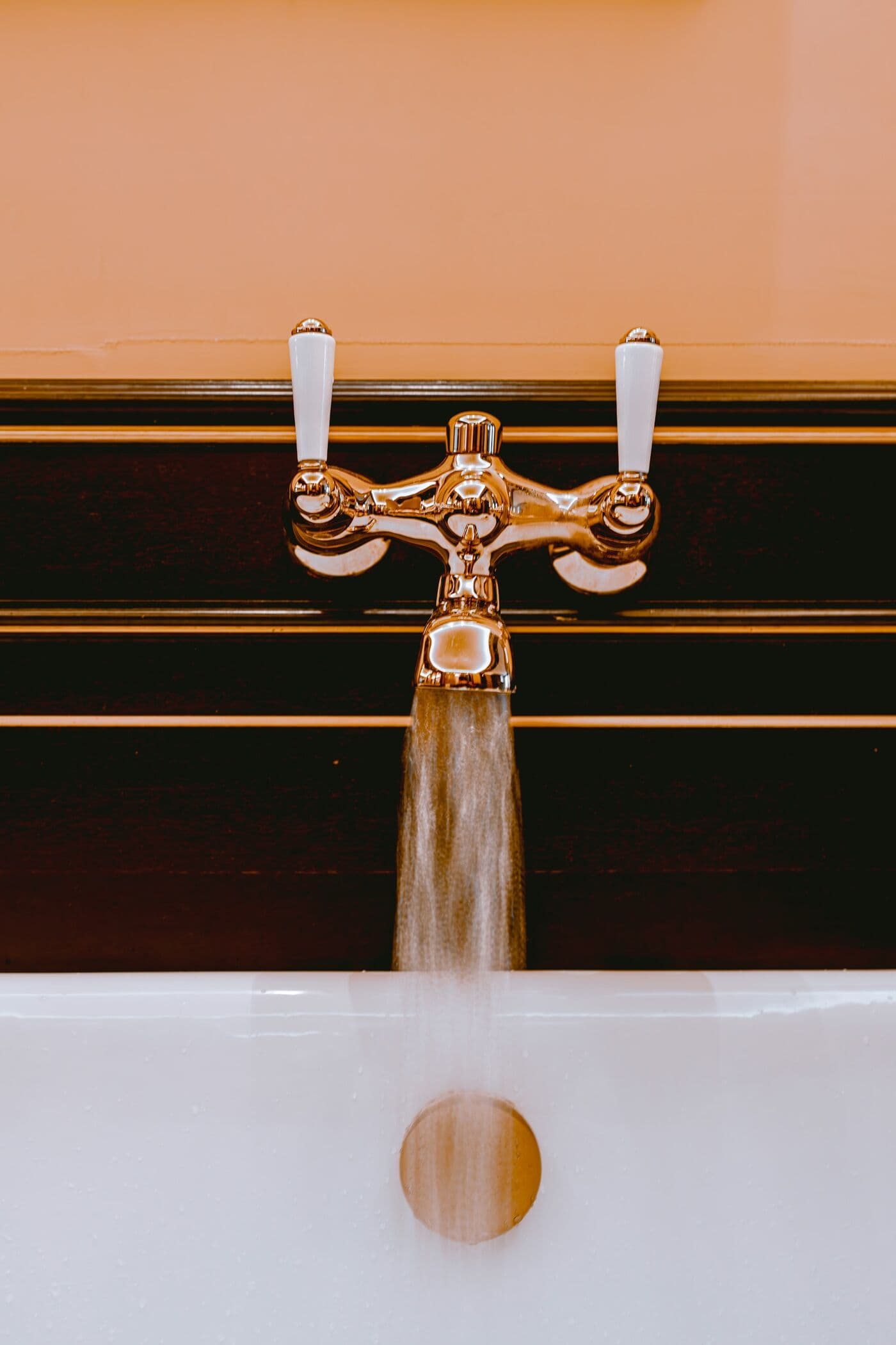 Water running from a polished copper tap
