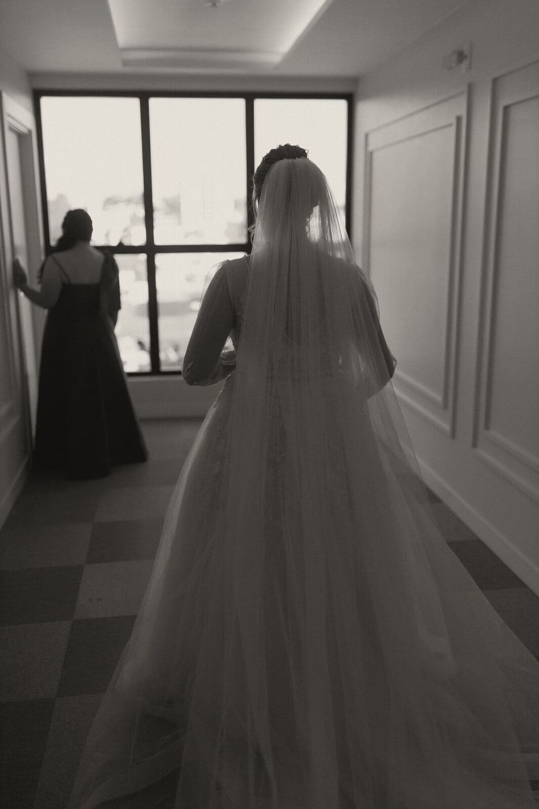 The bride walking towards the ceremony room