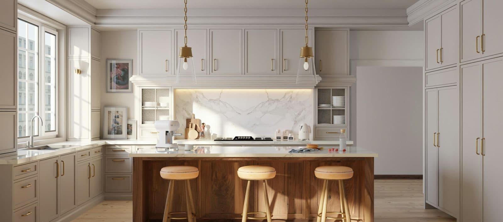 A pale painted kitchen with a walnut island and three stools