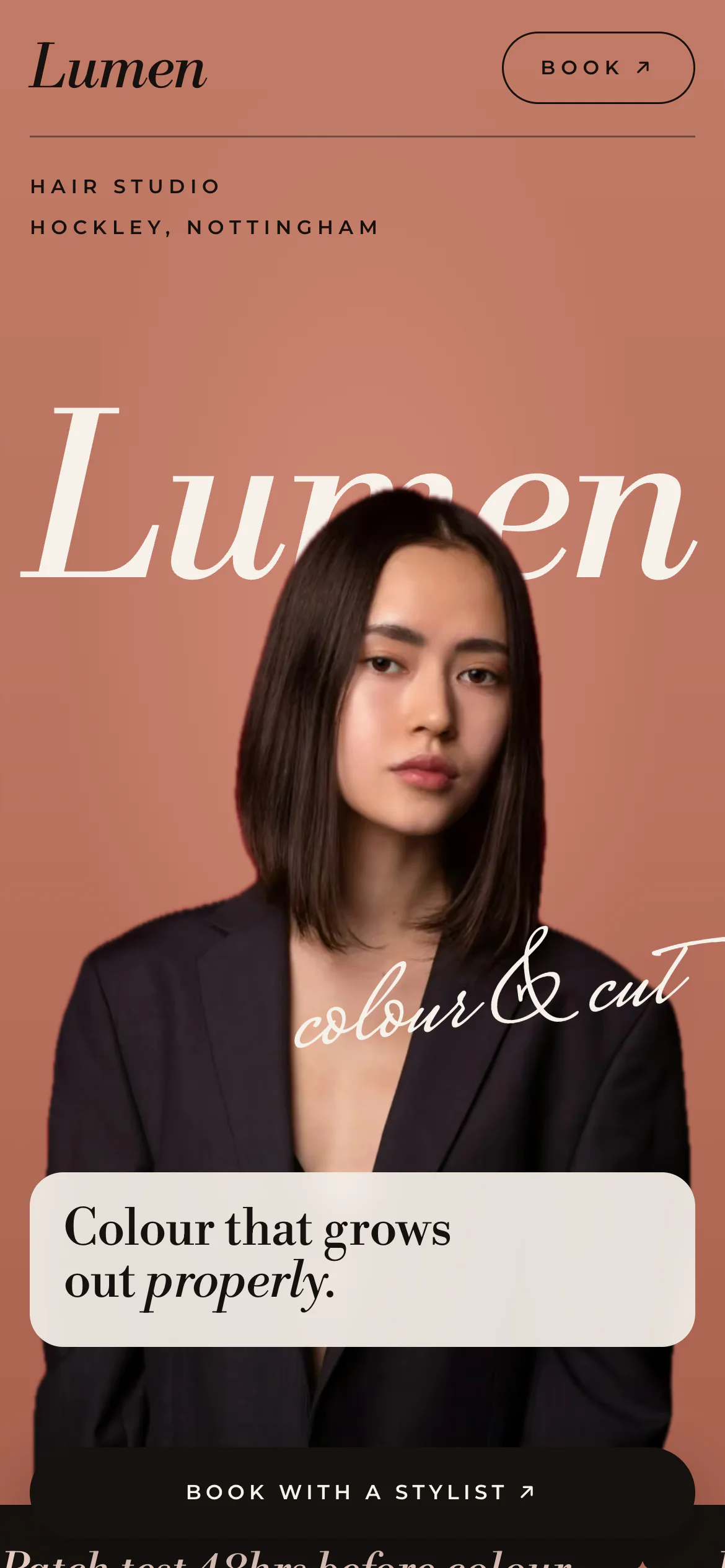 The Lumen Hair Studio website on a phone